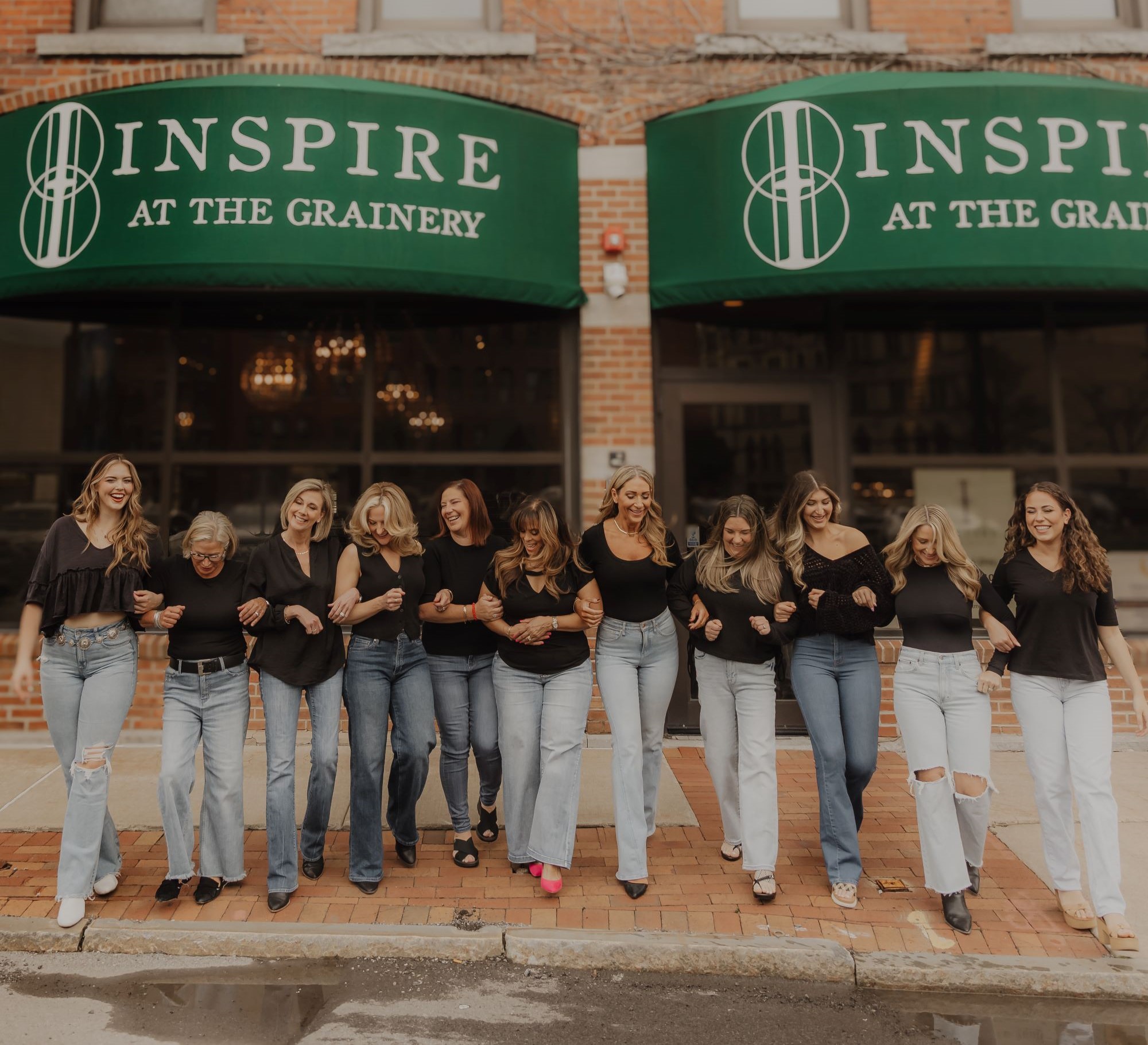 inspire at the grainery team outside the salon in syracuse, new york